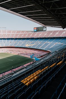 A serene view of Camp Nou Stadium seating, showcasing its vastness and iconic design in Barcelona, Spain.